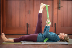 A hamstring stretch, one of the essential poses in practicing yoga for runners